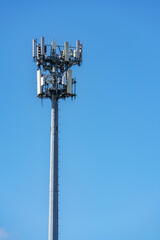 Photo of a cell tower on blue sky