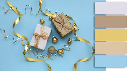 Composition with beautiful Christmas gifts and balls on light blue background. Different color...
