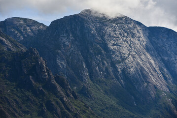 The sheer granite wall of the Pico do Baiano peak (2.050m) in the Serra do Cara&ccedil;a range, Catas Altas, Minas Gerais state, Brazil