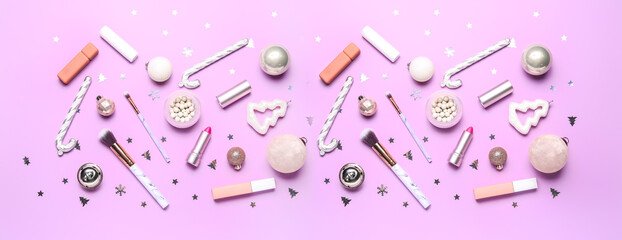 Set of makeup cosmetics with Christmas decorations on lilac background