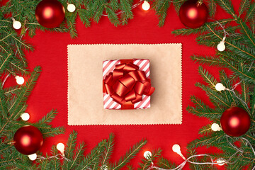 Fototapeta na wymiar box with a Christmas gift on a red festive background.