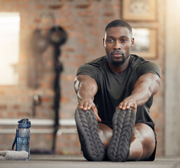 Black man, stretching and fitness in gym workout, training and exercise with health goals,...