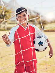 Children, fitness and soccer by boy on soccer field for sports, training and exercise, happy and...