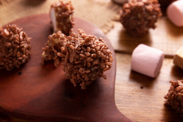 Homemade Caramel Marshmallows covered in chocolate flavor puffed rice, sweet treat easy to make, no baking required, ideal for parties and festivities, Christmas favorites.