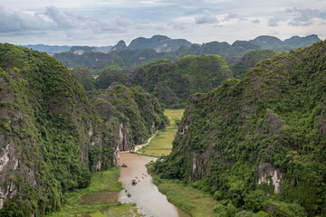 Lush green tropical forest mountains and Red River rice fields view at the Hang Mua Viewpoint in...