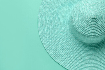 Fototapeta na wymiar Stylish straw hat on mint background
