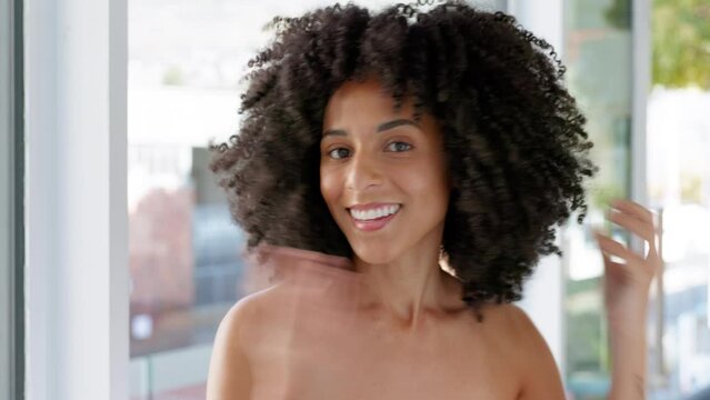 Black woman, natural hair and beauty while getting ready and feeling happy about hair care, growth and afro curl in home bathroom. Face portrait of a african model during morning self care routine