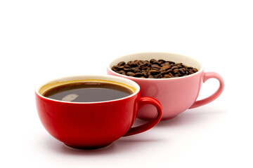 coffee in red cup and coffee beans in a pink cup isolated on white background.