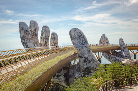 Golden Bridge stone hand bridge and mountain view observatory at the Ba Na Hills Sunworld in DaNang Vietnam	