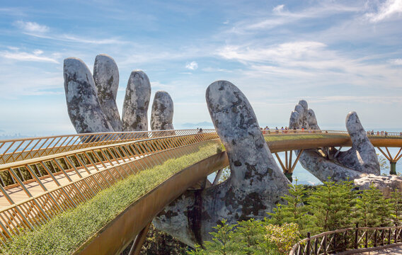 Golden Bridge stone hand bridge and mountain view observatory at the Ba Na Hills Sunworld in DaNang Vietnam 