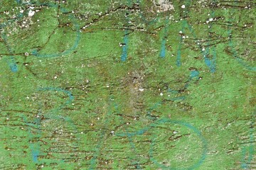 Background, texture of a concrete wall with remnants of green paint
