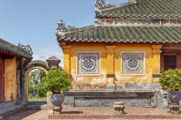 Colorful yellow stone building traditional architecture of the Hue Historic Citadel complex in Hue Vietnam