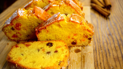 image of a delicious cupcake with raisins and candied fruit on a board close-up