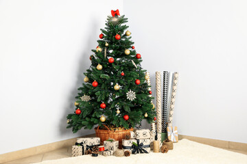 Christmas tree with beautiful presents in room