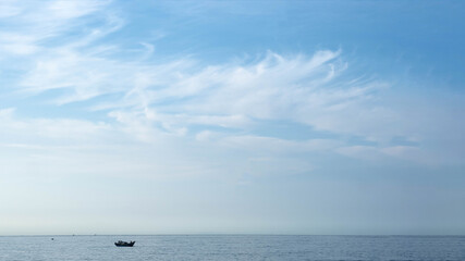 Atmosphere panorama white cloud clear blue sky horizon line calm empty sea lone fishing boat. Concept paradise life. Design relax wallpaper background. More tone format collection in stock