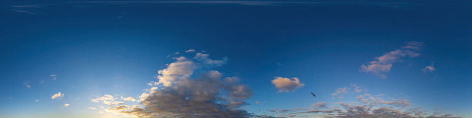 Panorama of a dark blue sunset sky with golden Cumulus clouds. Seamless hdr 360 panorama in spherical equiangular format. Full zenith for 3D visualization, sky replacement for aerial drone panoramas.