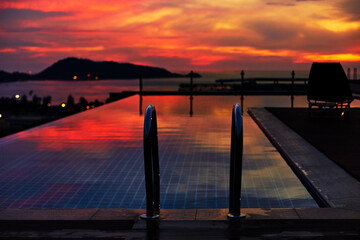 Luxurious rooftop pool at sunset. Swimming pool, vacation