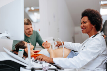Fototapeta premium Doctor doing pregnancy ultrasound.