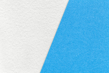 Fototapeta premium Texture of craft white and light blue paper background, half two colors. Vintage kraft cerulean cardboard.