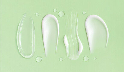 cosmetic smears cream texture on pastel green background