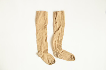 Brown long socks grazny on a white background close up
