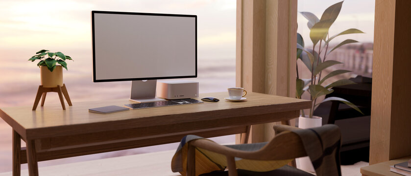 Comfortable and urban home workspace with computer mockup on wood table against the window