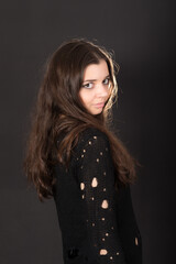 studio portrait of a girl on a black background