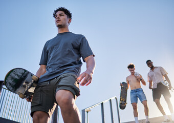 Skateboard, friends group and skatepark together, walking stairs and outdoor in summer sunshine. Skater diversity, happy and smile at metro park for sport, fitness and wellness with urban lifestyle © Irshaad M/peopleimages.com