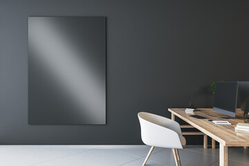 Designer coworking interior with empty black mock up screen on dark wall, desk, computer, chairs, decorative items, plants and supplies. Mock up, 3D Rendering.