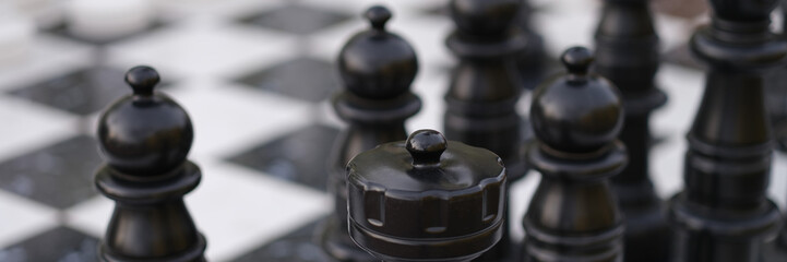 Fototapeta na wymiar Chessboard with chessmen, chess battle white against black
