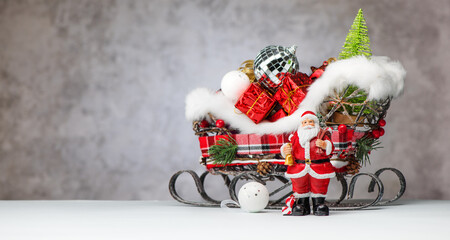 Christmas banner Santa Claus and sleigh with gifts. Merry christmas and happy new year greeting card