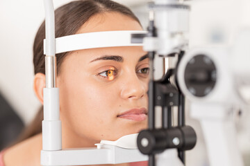 Healthcare, eyes and woman eye test at a clinic for vision, health and eyesight on a slit lamp...