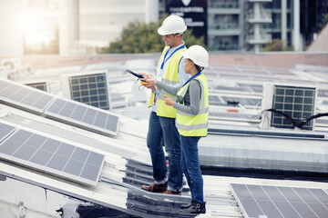 Sustainable engineering, solar panels and team doing maintenance on the rooftop of building in the...