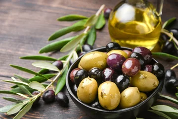 Küchenrückwand glas motiv Different kinds of olives with olive oil and herbs  © KEA