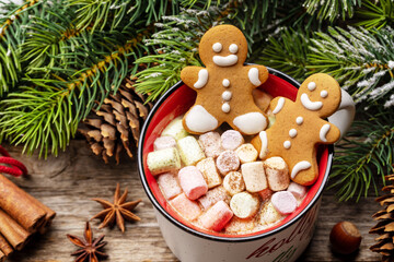 Gingerbread man cookies in a cup with marshmallow