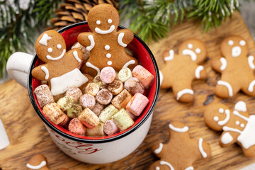 Gingerbread man cookies in a cup with marshmallow