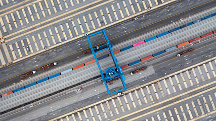 Aerial view of shipping container rail terminal, Train wagon cargo container for shipping, Aerial view of container terminal on railway.