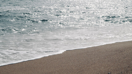 Bright sea background with beautiful light on the Costa Brava, Catalunya, Spain. Bright sea waters. Mediterranean sea. Space for text. Beach background. 