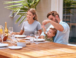 Food, mother and father with baby at table at an outdoor patio for holiday celebration with champagne and lunch in summer. Happy family, mom and dad with child fine dining together at home or house