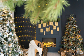 Beautiful holdiay decorated room with Christmas tree with presents under it