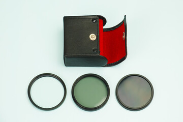 Set of screw-on photographic glass filters for UV protection, polarizing filter to reduce glare and...