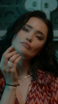 A woman is eating a chocolate 