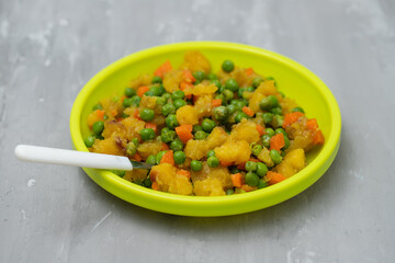 mixed vegetables peas, carrot, potato child plate