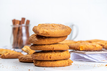 Homemade baked winter cinnamon cookies, Snickerdoodle bisquit scones on white kitchen background
