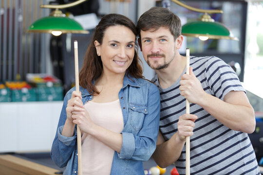 picture of pretty couple playing billards