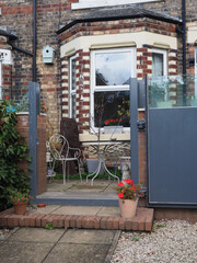 Metal flood protection gates fitted in the garden of a house in York in the UK