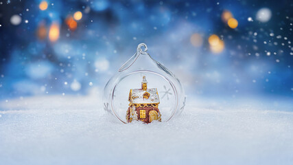  Cozy gingerbread house in christmas bauble over snowy background with copy space