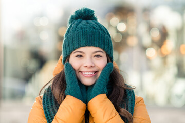 Portrait of cute cheerful person hands cheeks toothy smile look camera enjoy free time outdoors