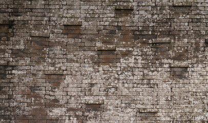 Balinese brick wall texture, stained moss brick wall, irregular pattern,  protruding bricks, 