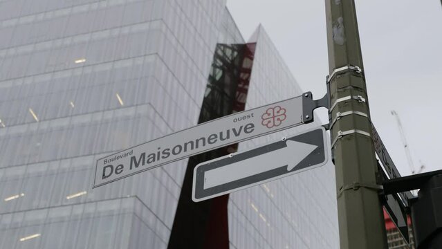 Directional Street Signage On A Signpost In Boulevard de Maisonneuve, Quebec City, Canada. low angle